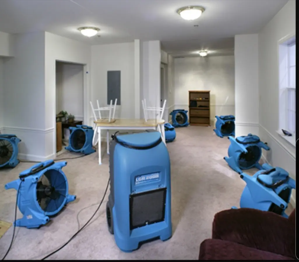 Air movers and dehumidifier setup for Water Damage Restoration in Laketown
